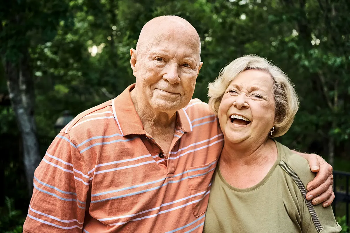 A senior couple smiling